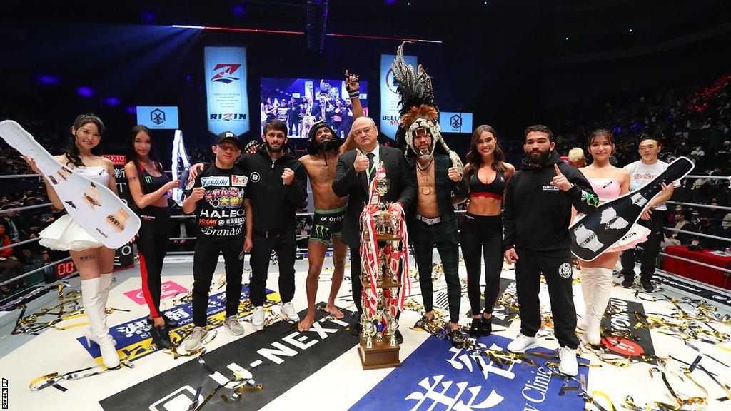 Bellator fighters and Scott Coker pose for a photo at the end of the co-promotional event with Rizin on New Year's Eve