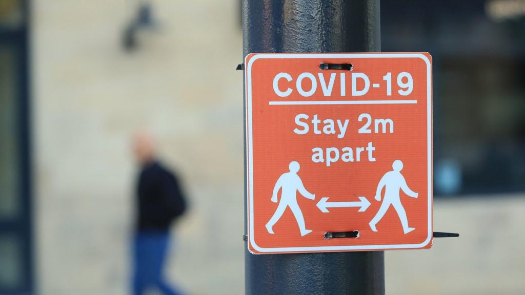 A "stay 2m apart" sign in Manchester