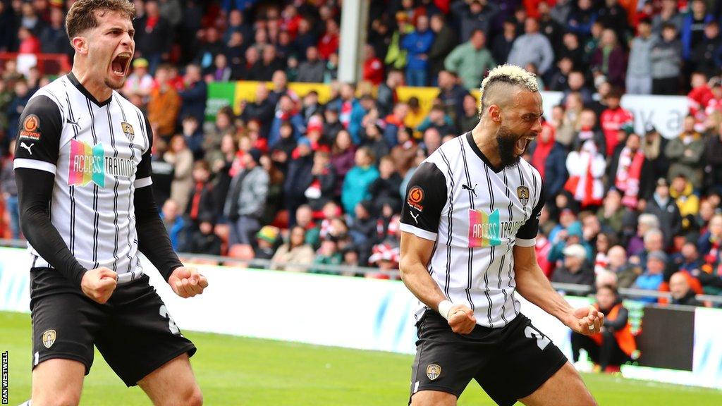 Notts County's John Bostock (right) celebrates scoring the opening goal against Wrexham