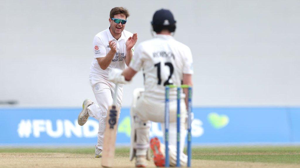 Liam Dawson celebrates the wicket of Middlesex's Sam Robson