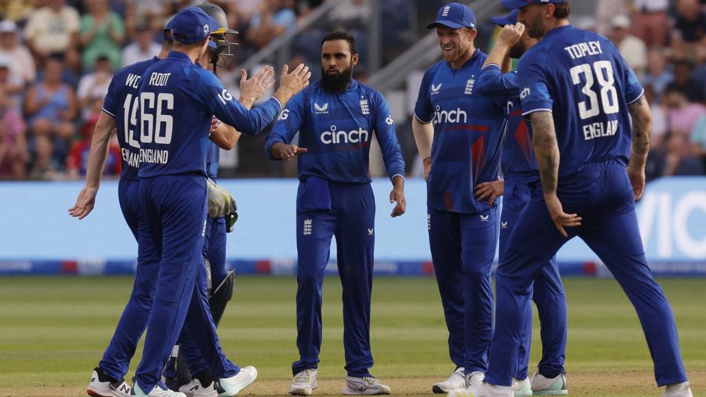 Adil Rashid celebrates the wicket of Will Young