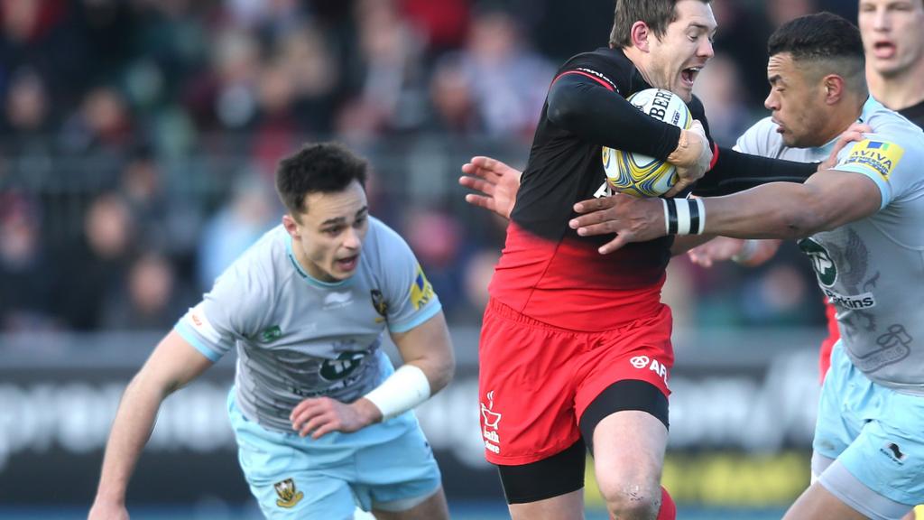 Alex Goode of Saracens holds off Luther Burrell