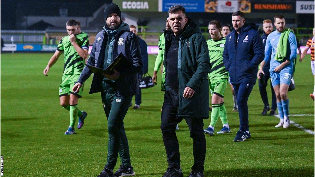 David Horseman (centre right) walks off the pitch after the end of a game