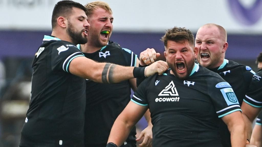 Tom Botha of Ospreys, celebrates with team-mates (L-R) Rhys Davies, Will Griffiths and Ethan Lewis