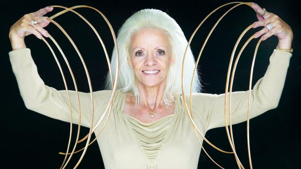 Lee Redmond, who had the longest fingernails ever with a length of 8.65m (28ft 4.5in) in 2008, as the Guinness World Records celebrates its 60th anniversary.