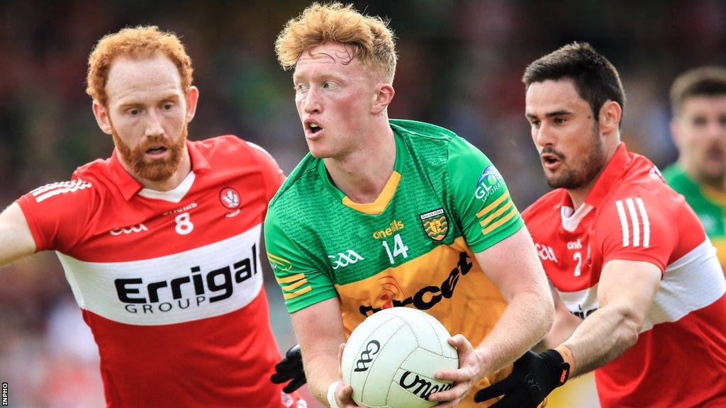 Oisin Gallen attempts to burst away from Derry's Chrissy McKaigue and Conor Glass at Ballybofey