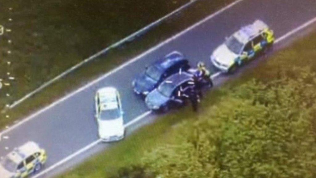 Helicopter shot of arrest of dangerous driver