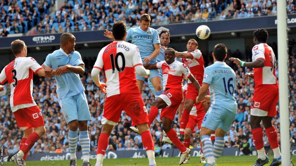 Edin Dzeko scores for Manchester City on the final day of the Premier League season