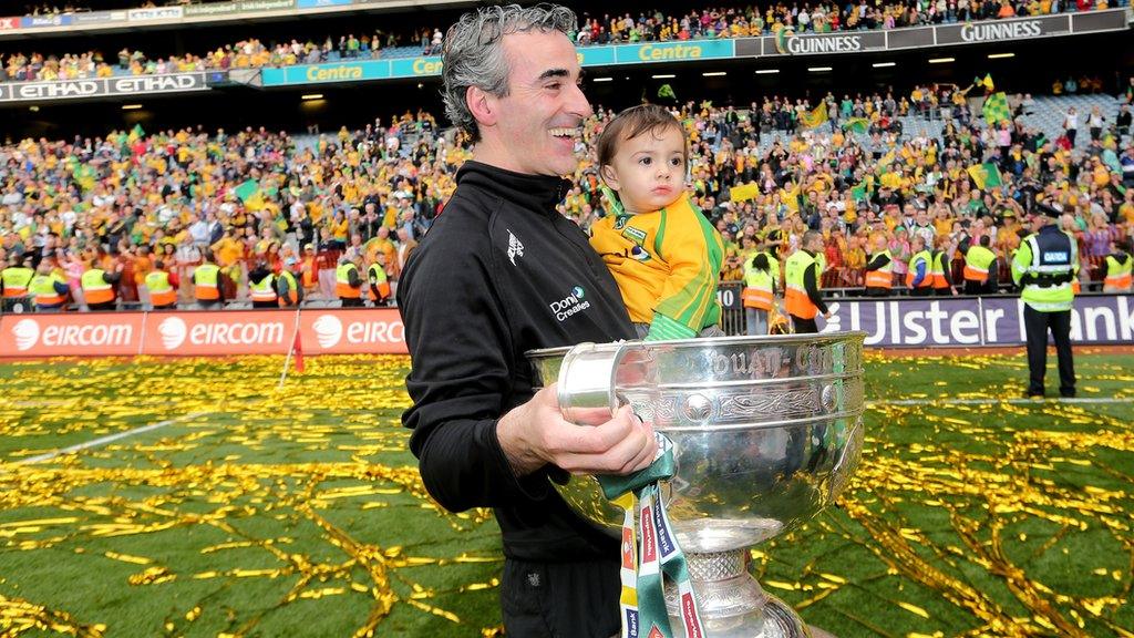 Jim McGuinness holds his son Jim and the Sam Maguire Cup after Donegal's All-Ireland Final triumph over Mayo in 2012