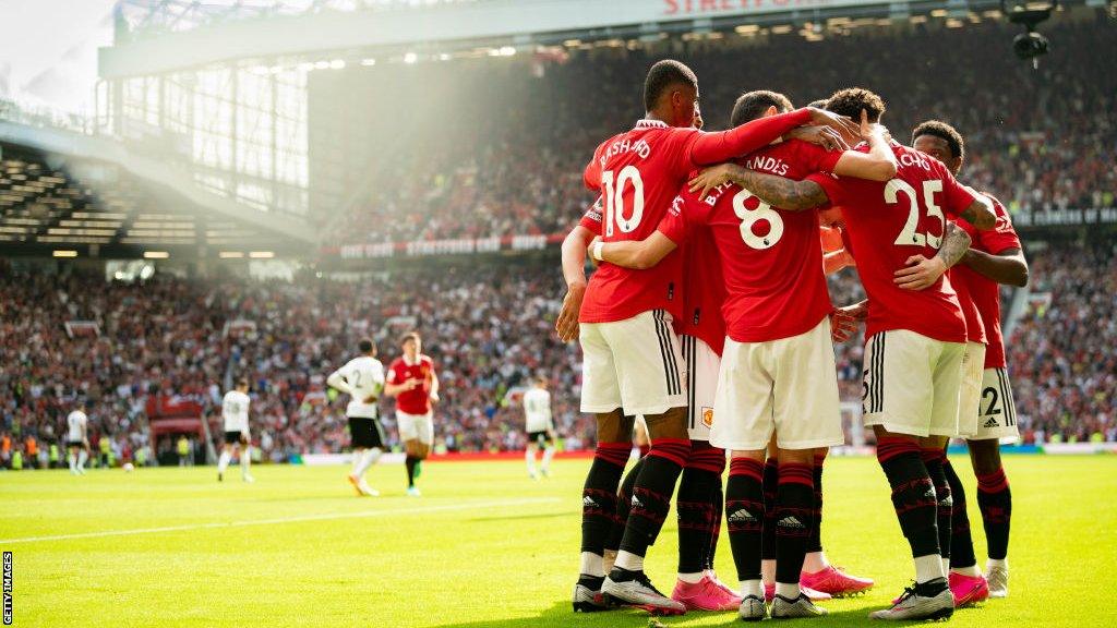 Manchester United players celebrate Jadon Sancho's first goal for the club