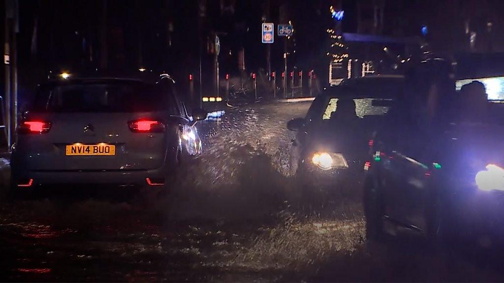 Flooding in south Wales with cars driving through water