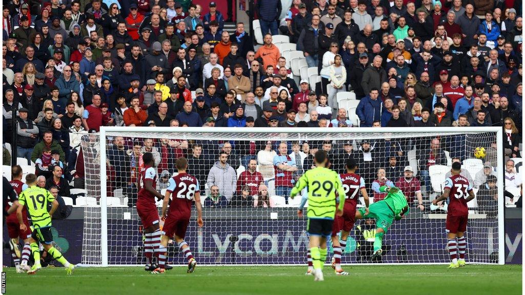 Leandro Trossard scoring Arsenal's fourth goal