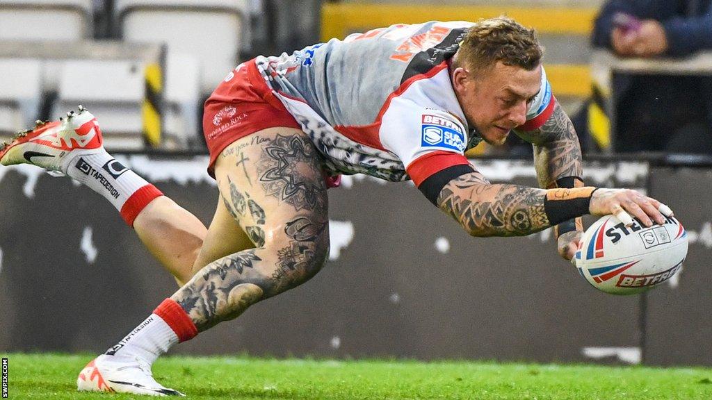 Josh Charnley dives for the corner to score for Leigh