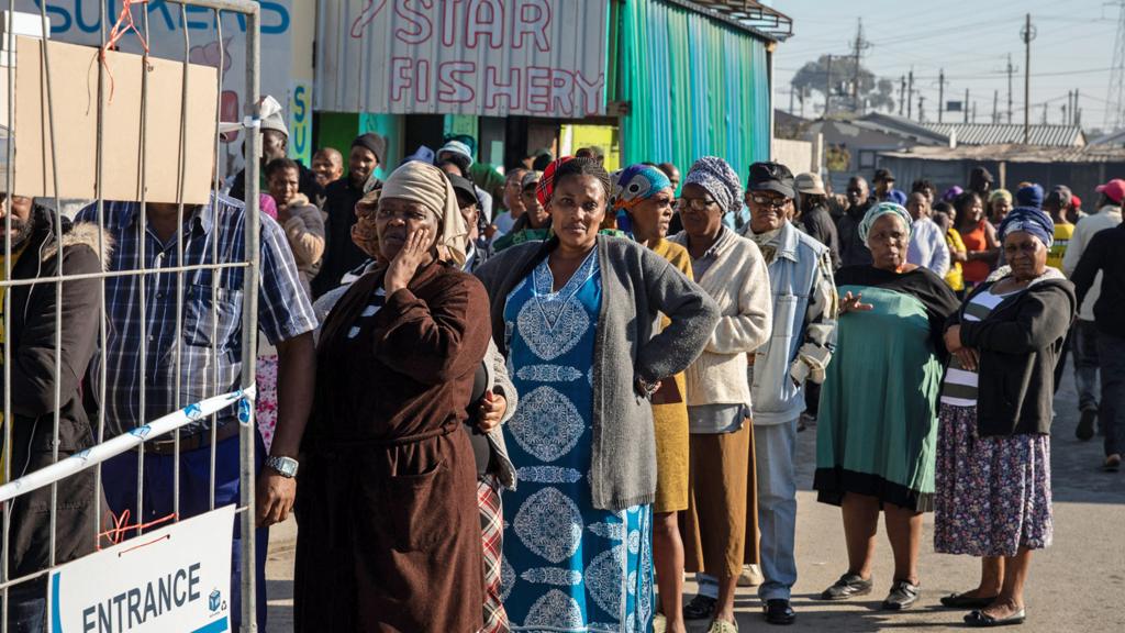 Voters queue outside a polling station in the Khayelitsha township, Cape Town, South Africa, on 29 May 2024