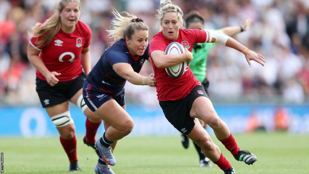 Natasha Hunt runs with the ball for England