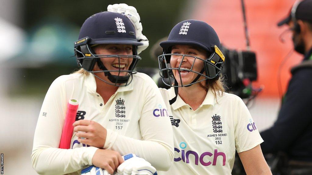 England's Sophie Ecclestone and Kate Cross celebrate earning a draw against Australia in the 2022 Women's Ashes