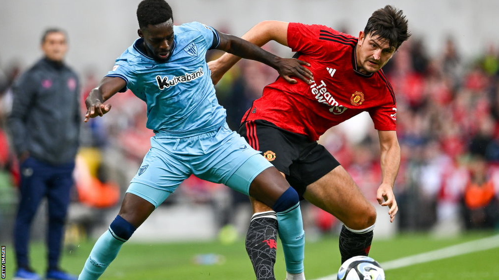 Inaki Williams of Athletic Bilbao and Harry Maguire of Manchester United battle for the ball during a pre-season friendly match