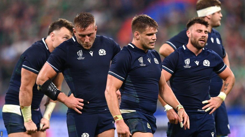 Scotland players look dejected after exiting the Rugby World Cup