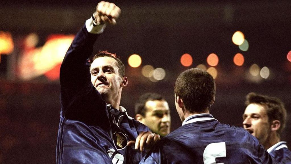 Scotland player celebrates a goal