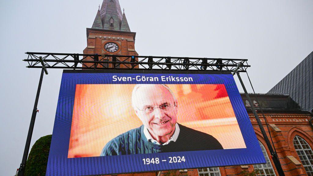 A photograph of the late Swedish football manager Sven-Goran Eriksson adorns a screen in front of the Fryksande church in Torsby, Sweden,