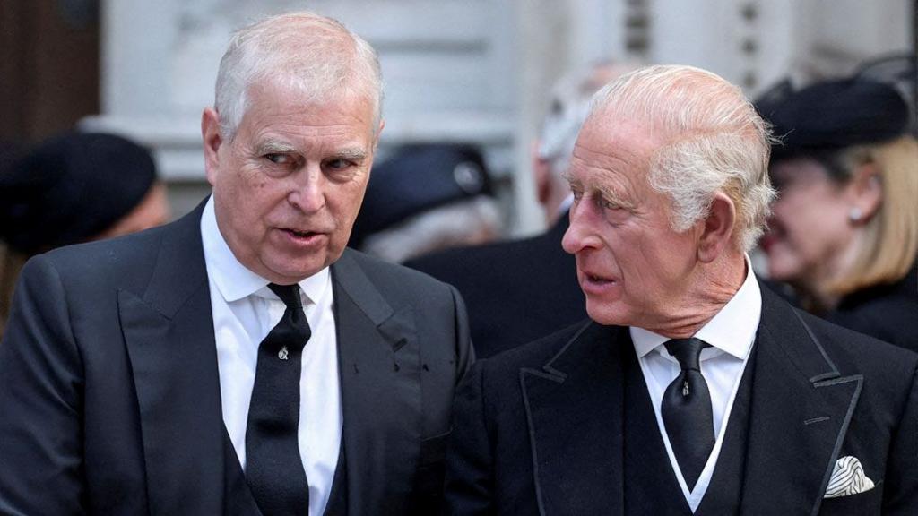 Britain's Prince Andrew speaks with King Charles as they leave Westminster Cathedral at the end of the Requiem Mass, on the day of the funeral of Britain's Katharine, Duchess of KeNt