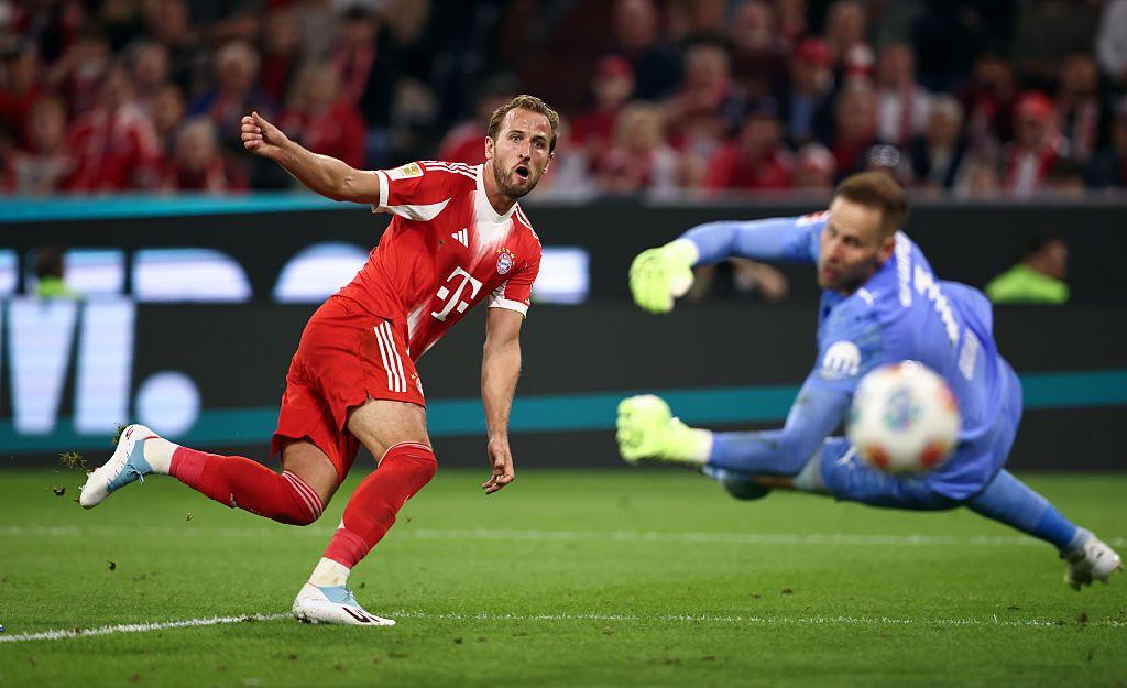 Bayern Munich's Harry Kane scores past RB Leipzig's Peter Gulasci during the Bundesliga match at Allianz Arena in Munich, Germany. Photo by Stefan Matzke