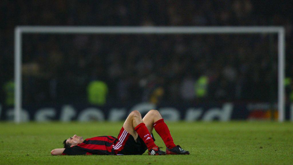 Bayer Leverkusen's Oliver Neuville collapses on the field after his team was defeated by Real Madrid in the Champions League final 15 May 2002 in Glasgow. 