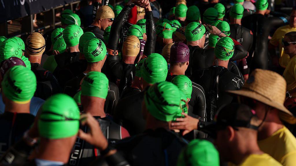 Athletes lined up at Swansea Marina on Sunday morning to tackle the first of three disciplines in this middle distance triathlon.