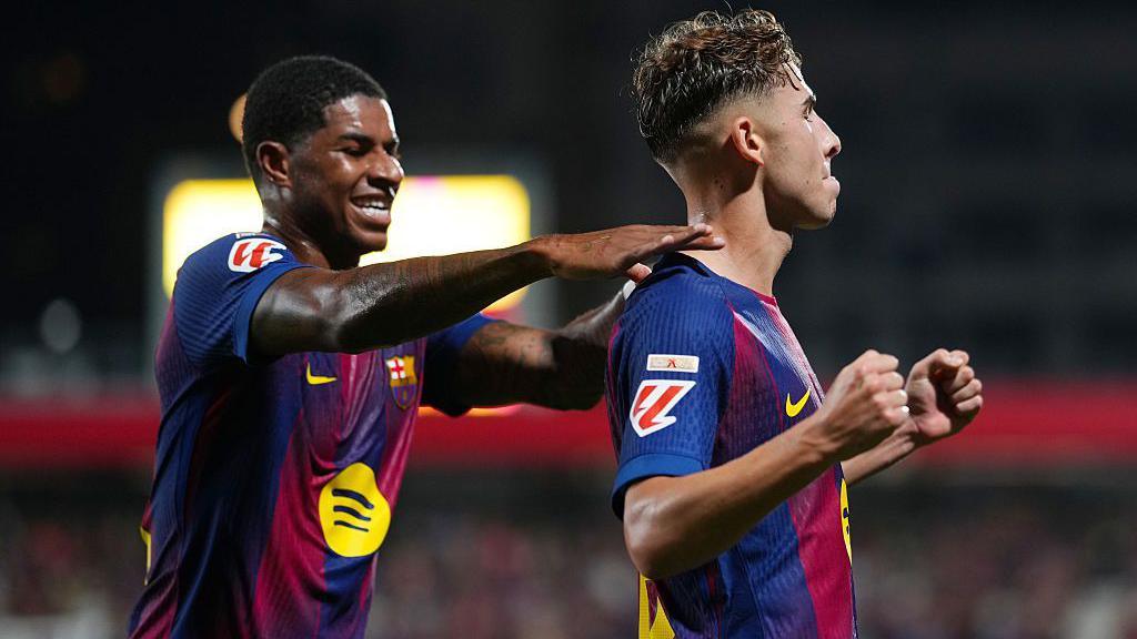 Marcus Rashford and Fermin Lopez celebrate a Barcelona goal against Valencia