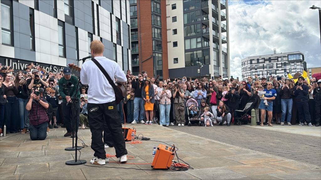 Rear view of Ed Sheeran playing at Ipswich Waterfront
