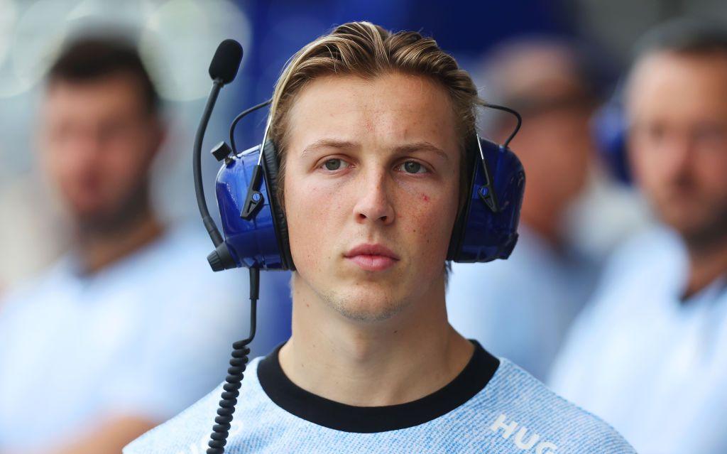 Liam Lawson wearing headphones at the Singapore Grand Prix