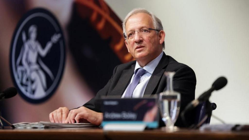 Sir Jon Cunliffe sat behind a desk 