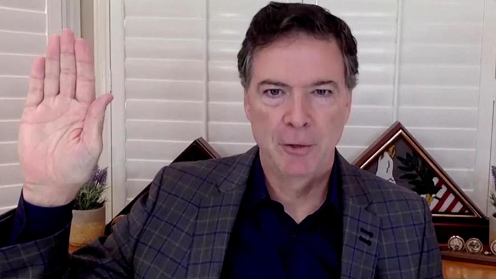 James Comey, former director of the Federal Bureau of Investigation (FBI), is seen in a frame grab from a video feed as he is sworn in remotely from his home during a Senate Judiciary Committee hearing exploring the FBI's investigation of the 2016 Trump campaign and Russian election interference in Washington, U.S., September 30, 2020. 