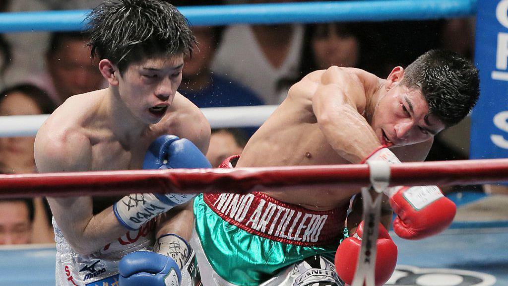Kosei Tanaka is punched by Moises Fuentes in a fight