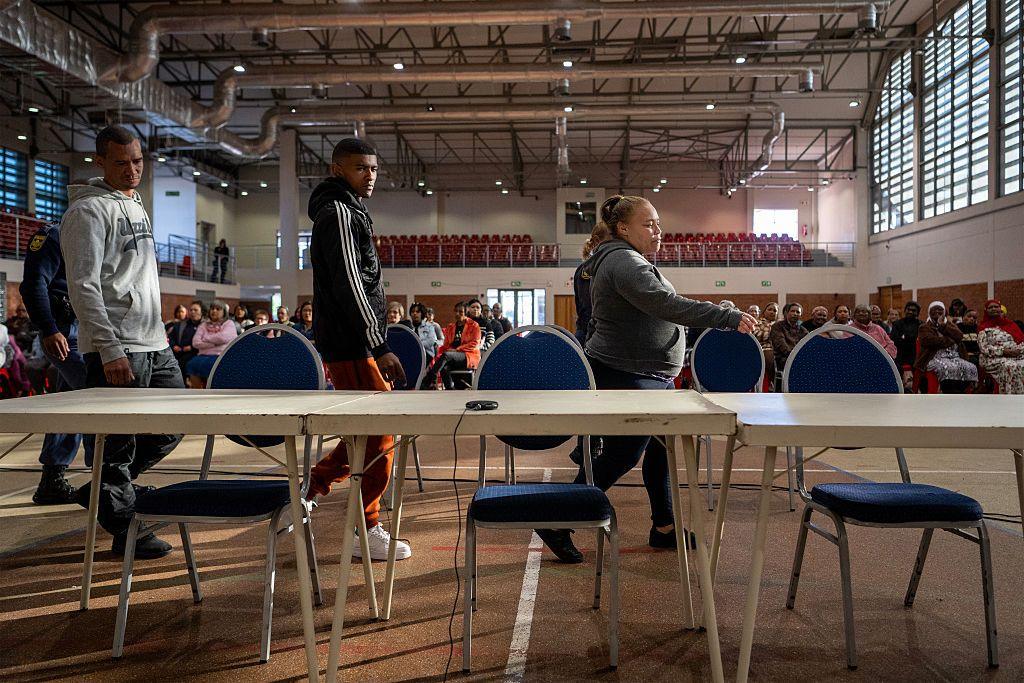 The three accused walking in for a sentencing hearing in Saldanha Bay in a community centre - 27 May 2025.