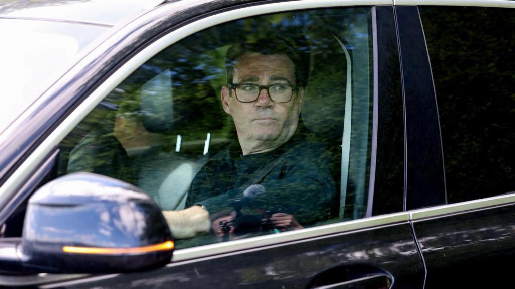 Andy Burnham sitting in car