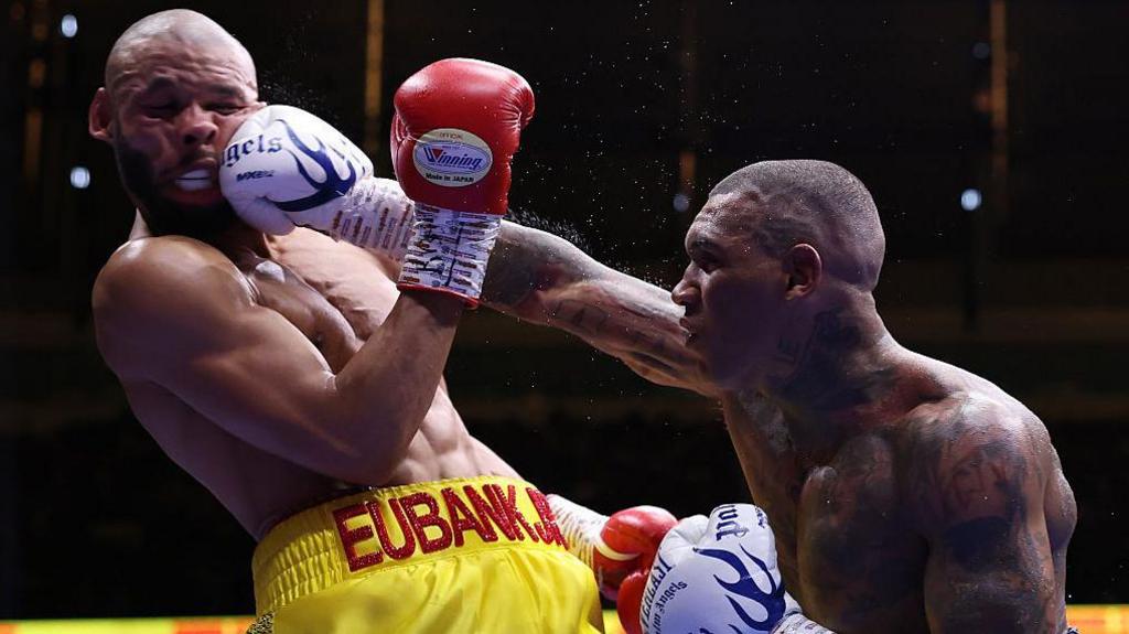Chris Eubank Jr's face contorts as he is punched by Conor Benn
