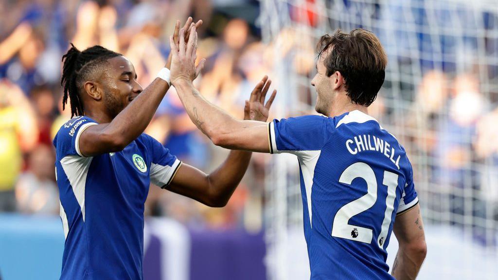 Christopher Nkunku celebrates a goal with Ben Chilwell