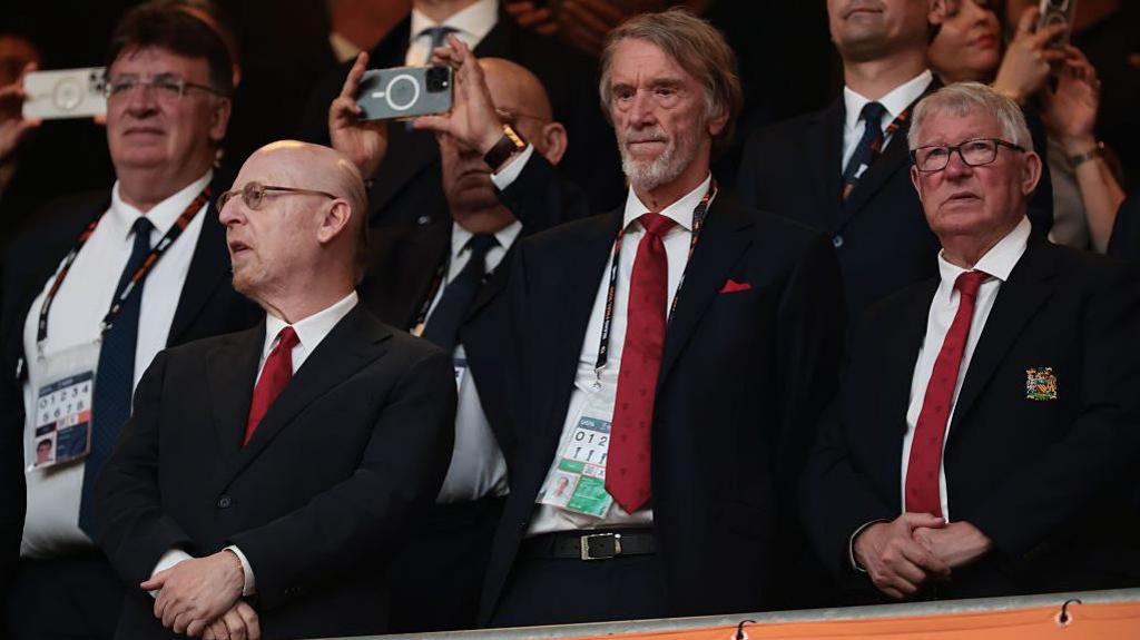 Avram Glazer Co-Chairman of Manchester United, Sir Jim Ratcliffe Manchester United Co-Owner and Sir Alex Ferguson look on from the tribune prior to kick off in the UEFA Europa League Final 2025 between Tottenham Hotspur and Manchester United