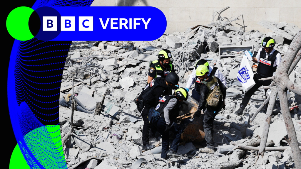 Rescuers at work in southern Israel after an Israeli missile strike