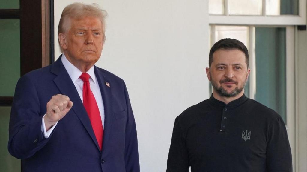 US President Donald Trump gestures as Ukrainian President Volodymyr Zelenskiy looks on on the day they meet at the White House in Washington, D.C., U.S., February 28, 202