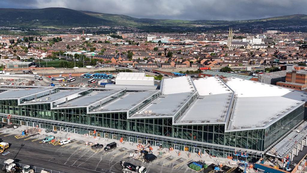 An aerial view of a rail and bus station in central Belfast