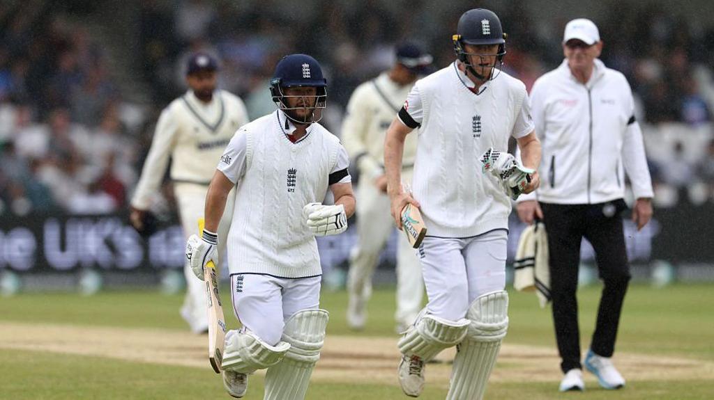 Ben Duckett and Zak Crawley running off the field at Headingley due to poor weather