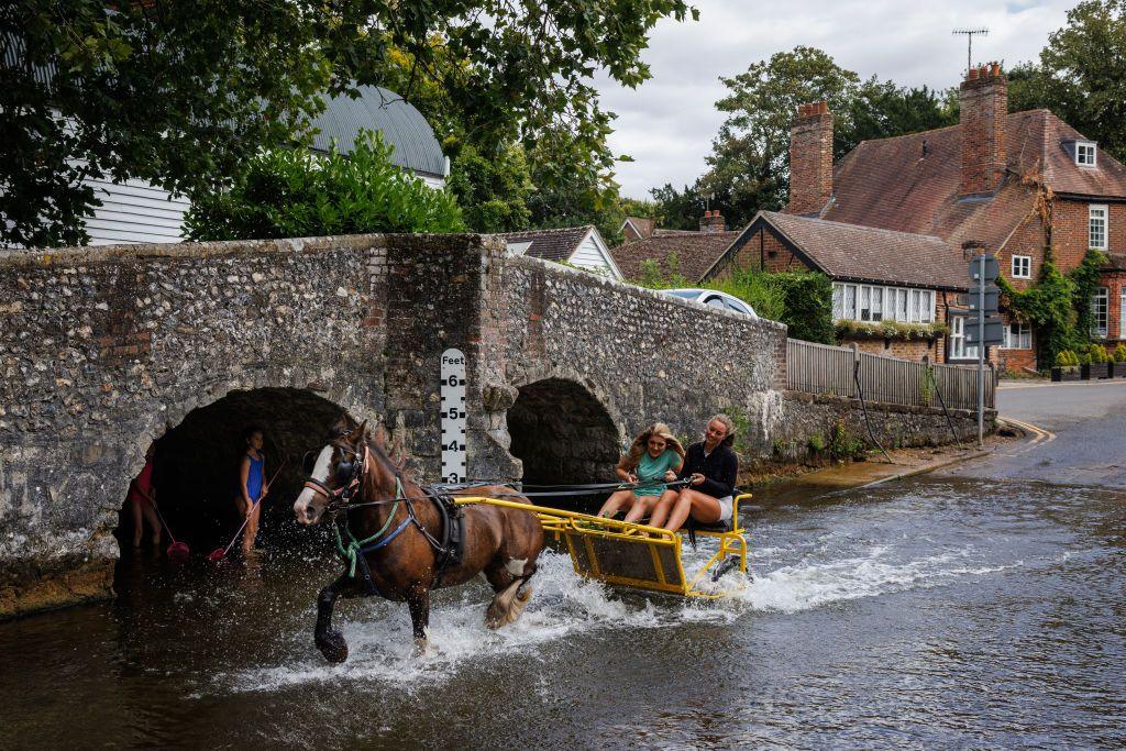 A horse and cart ride through the ford on the River Darent