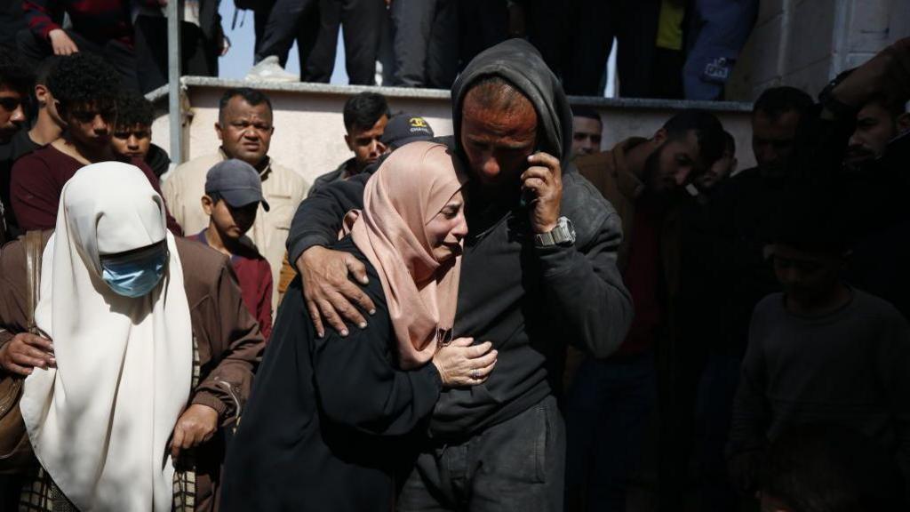 Relatives of the 9 Palestinians, including 3 journalists, who died as a result of Israeli airstrikes on the Beit Lahia, mourn as the dead bodies brought to the Indonesian Hospital in Beit Lahia, Gaza on March 15, 2025. 