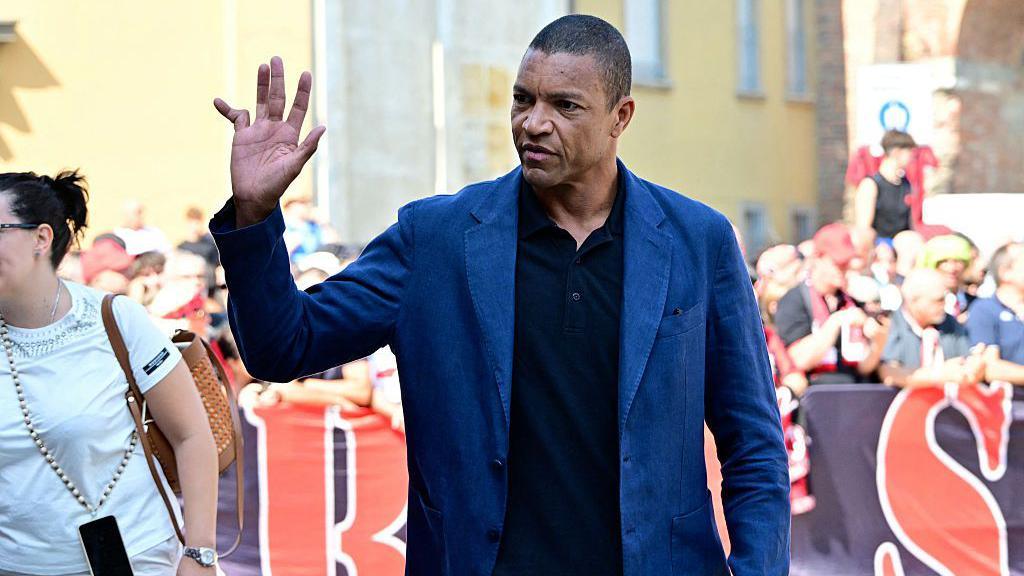 AC Milan's former Brazilian goalkeeper Dida waves to the crowd at Franco Baresi's funeral