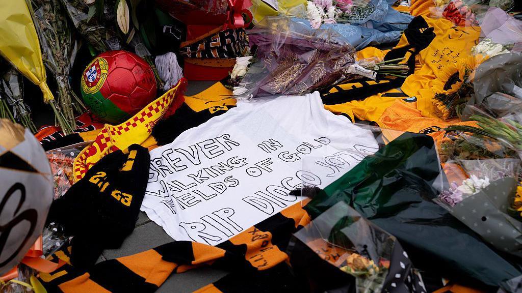 Tribute at Molineux that says 'forever walking in fields of gold'