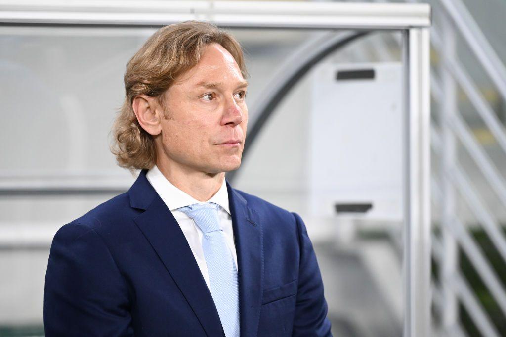 Russia manager Valery Karpin looks on from the touchline during a match.