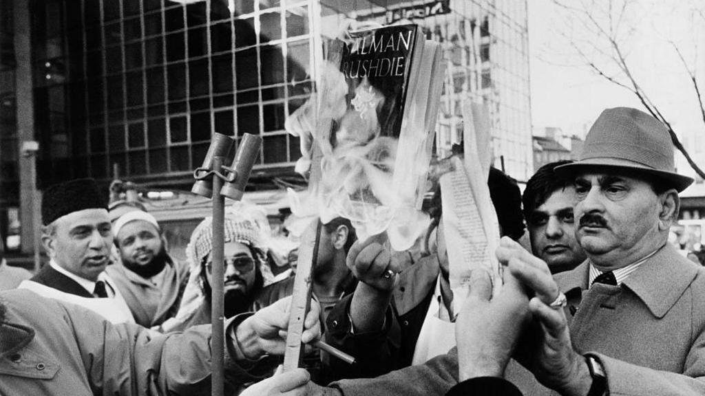 Muslims burning copies of Salman Rushdie's novel 'The Satanic Verses' in Bradford, UK, circa 1988. 