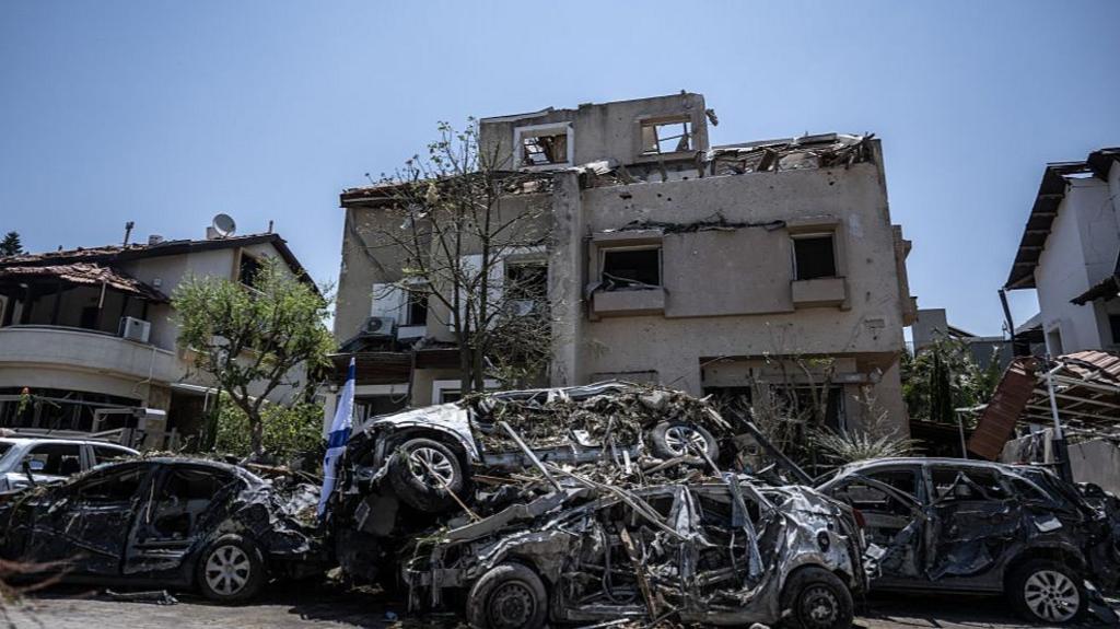 Iran retaliates with missile attacks on Israel, as Netanyahu urges Iranians to stand up to regime